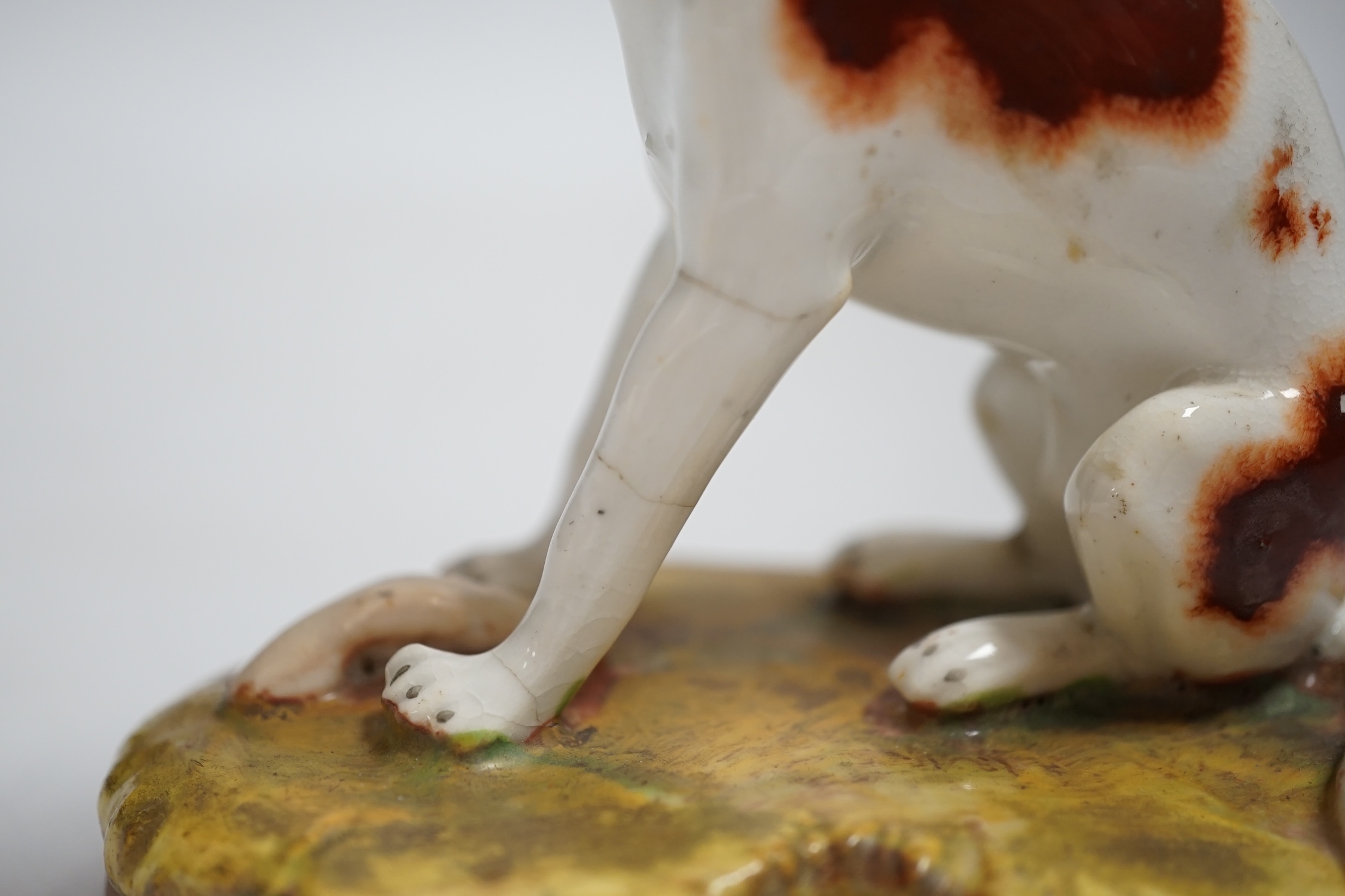 A rare Staffordshire porcelain model of a pointer, c.1830-50, 10cm high